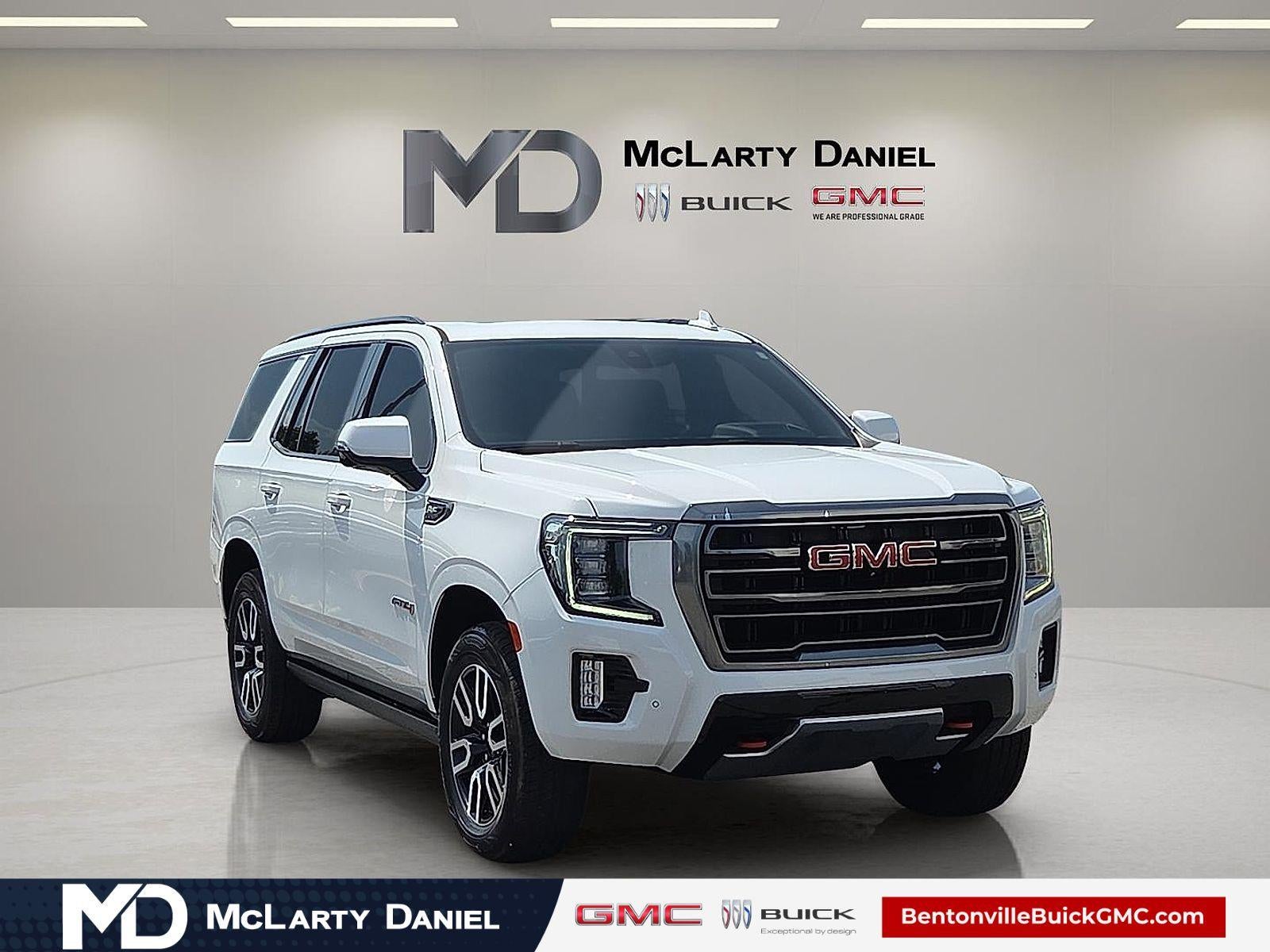 2021 GMC Yukon AT4 in Summit White — front three-quarter view