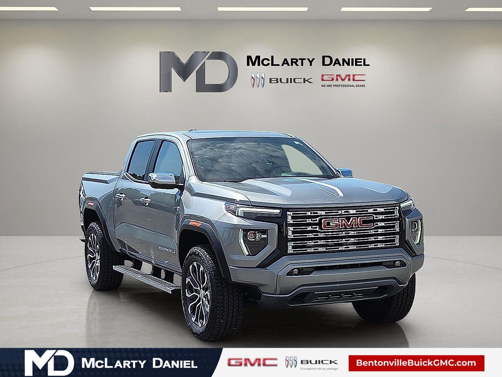 2024 GMC Canyon Denali in Sterling Metallic — front three-quarter view