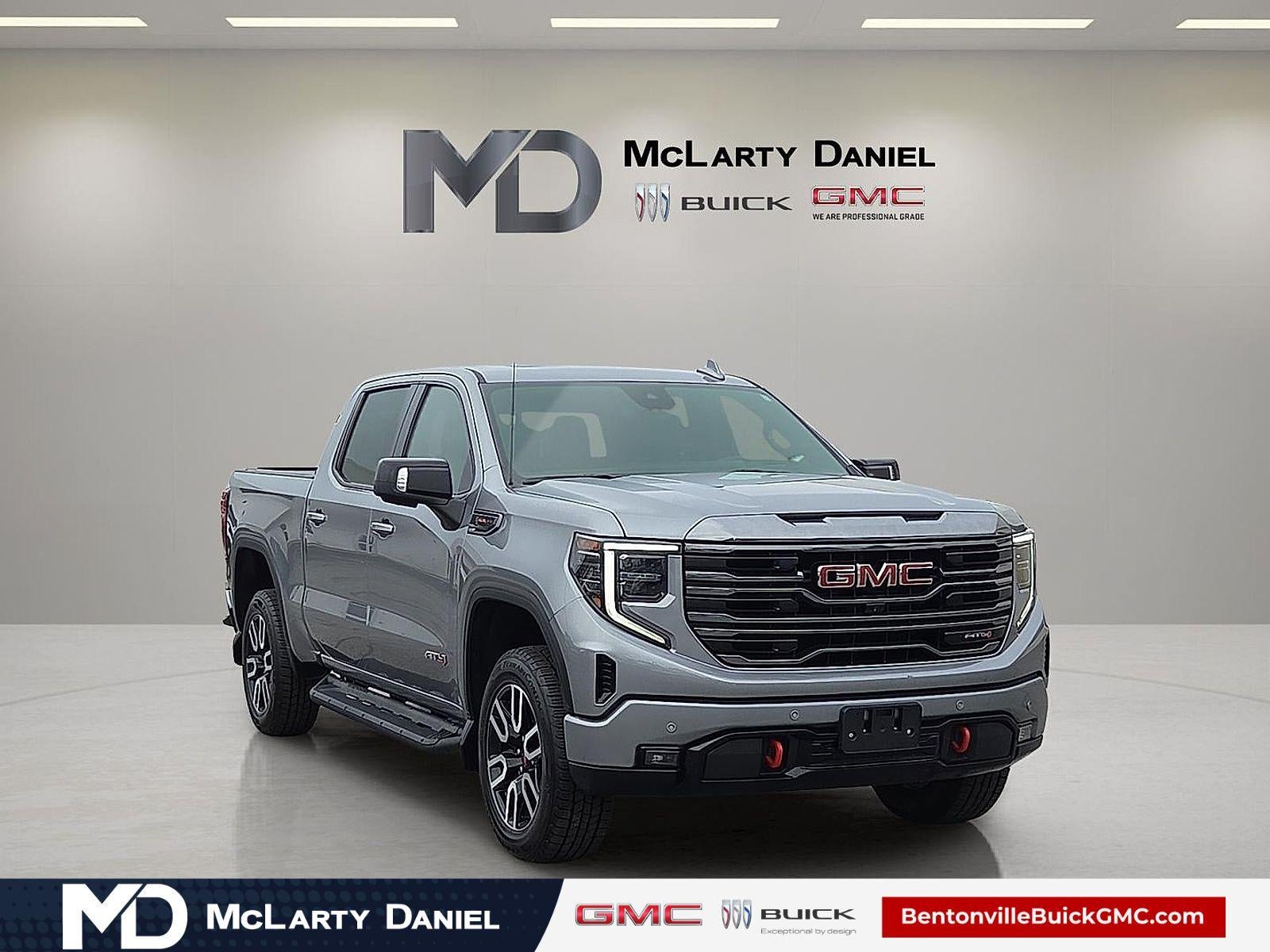 2024 GMC Sierra 1500 AT4 in Sterling Metallic — front three-quarter view
