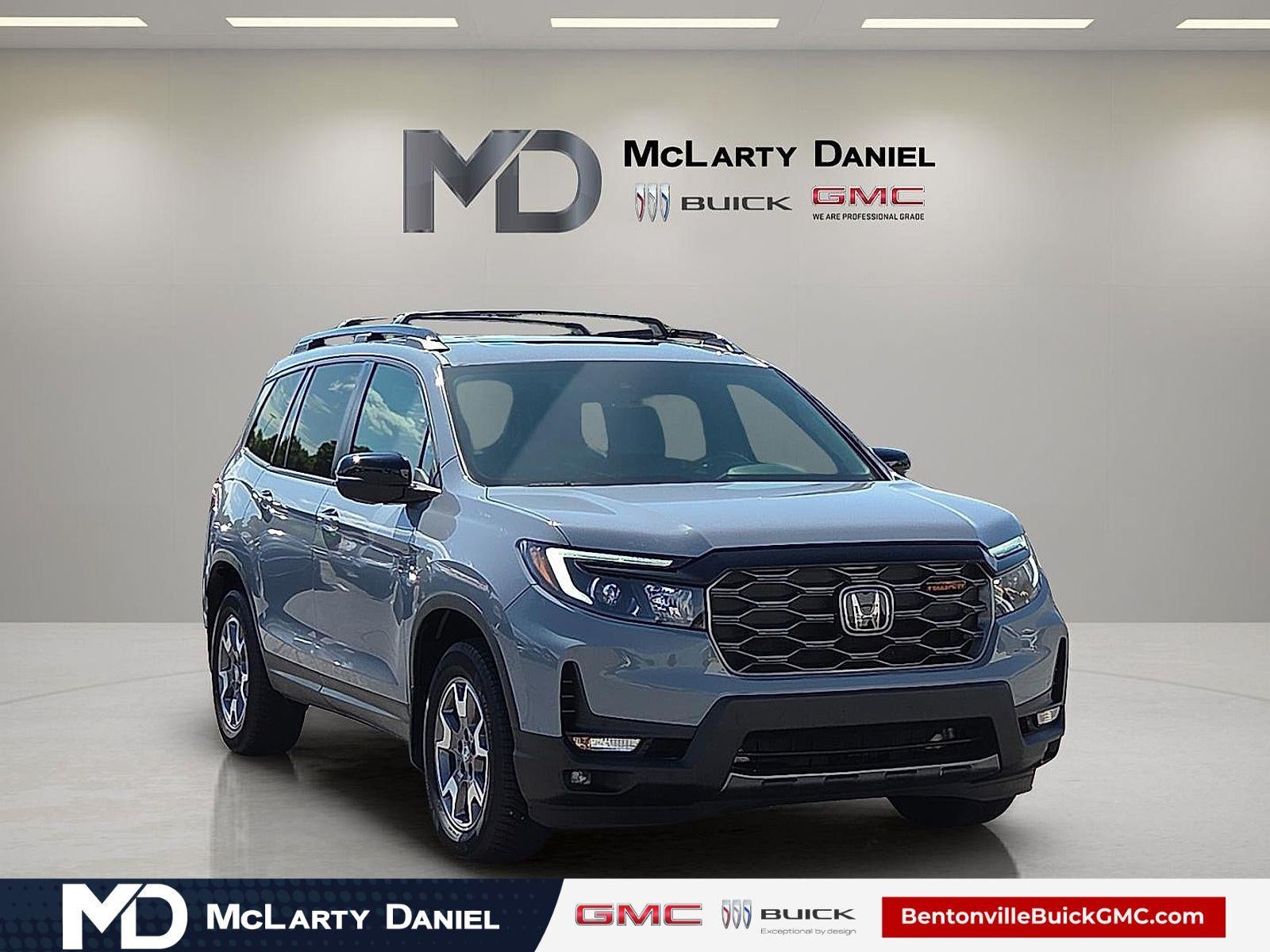 2023 Honda Passport AWD TrailSport in Gray — front three-quarter view