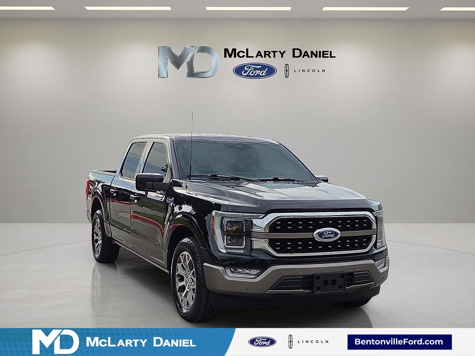 2022 Ford F-150 King Ranch in Agate Black Metallic — front three-quarter view