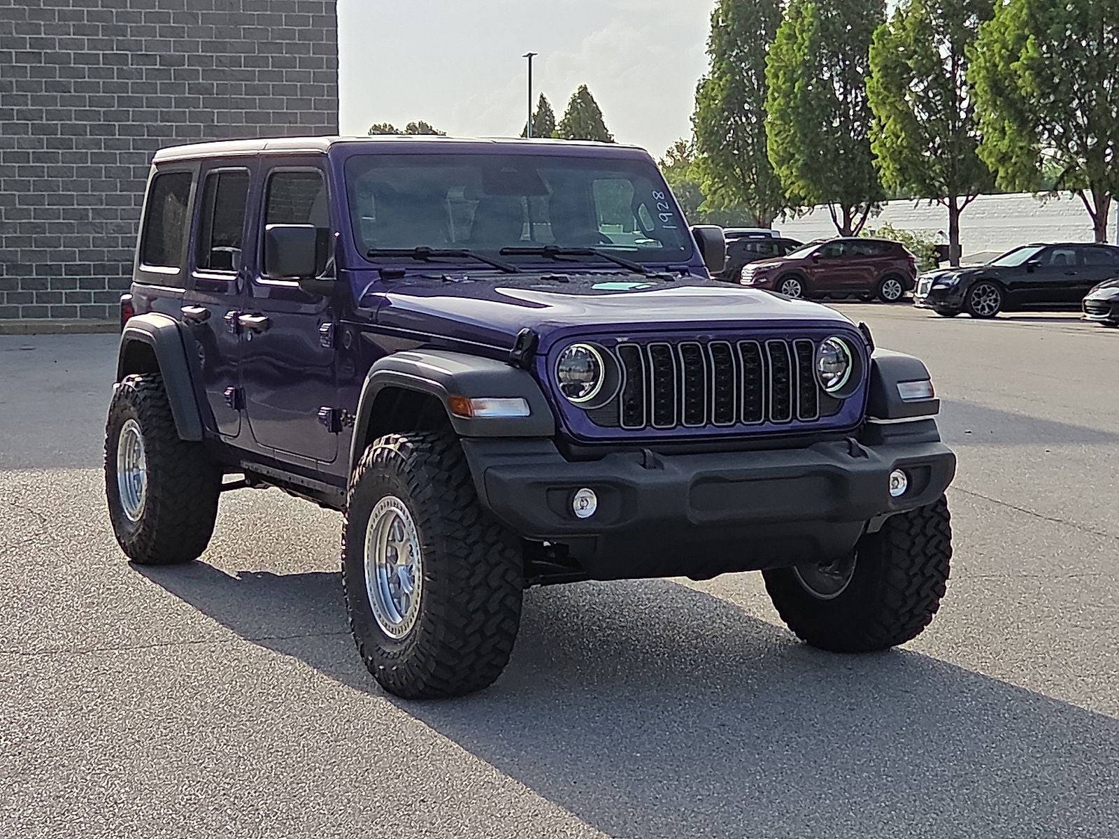 2026 Jeep Wrangler WRANGLER 4-DOOR SPORT S in Reign Exterior Paint — front three-quarter view