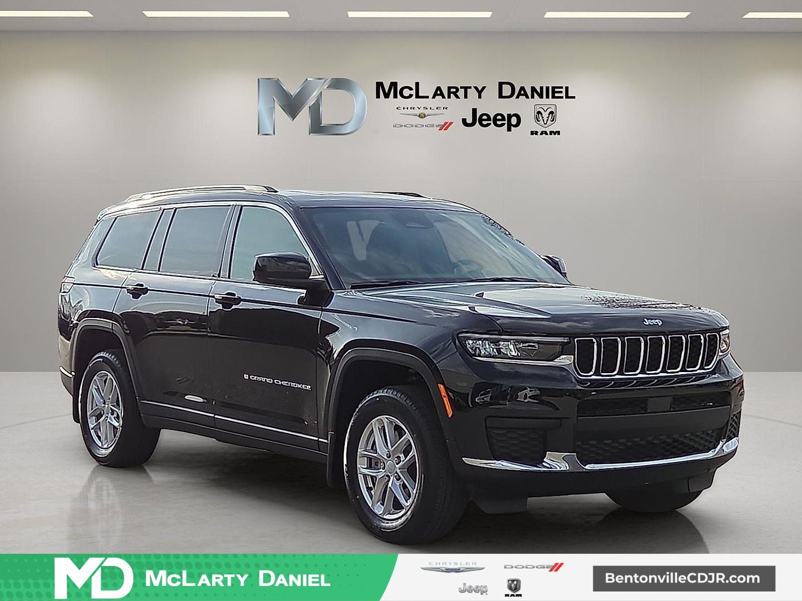 2026 Jeep Grand Cherokee GRAND CHEROKEE L LAREDO X 4X4 in Diamond Black Crystal Pearl-Coat Exterior Paint — front three-quarter view