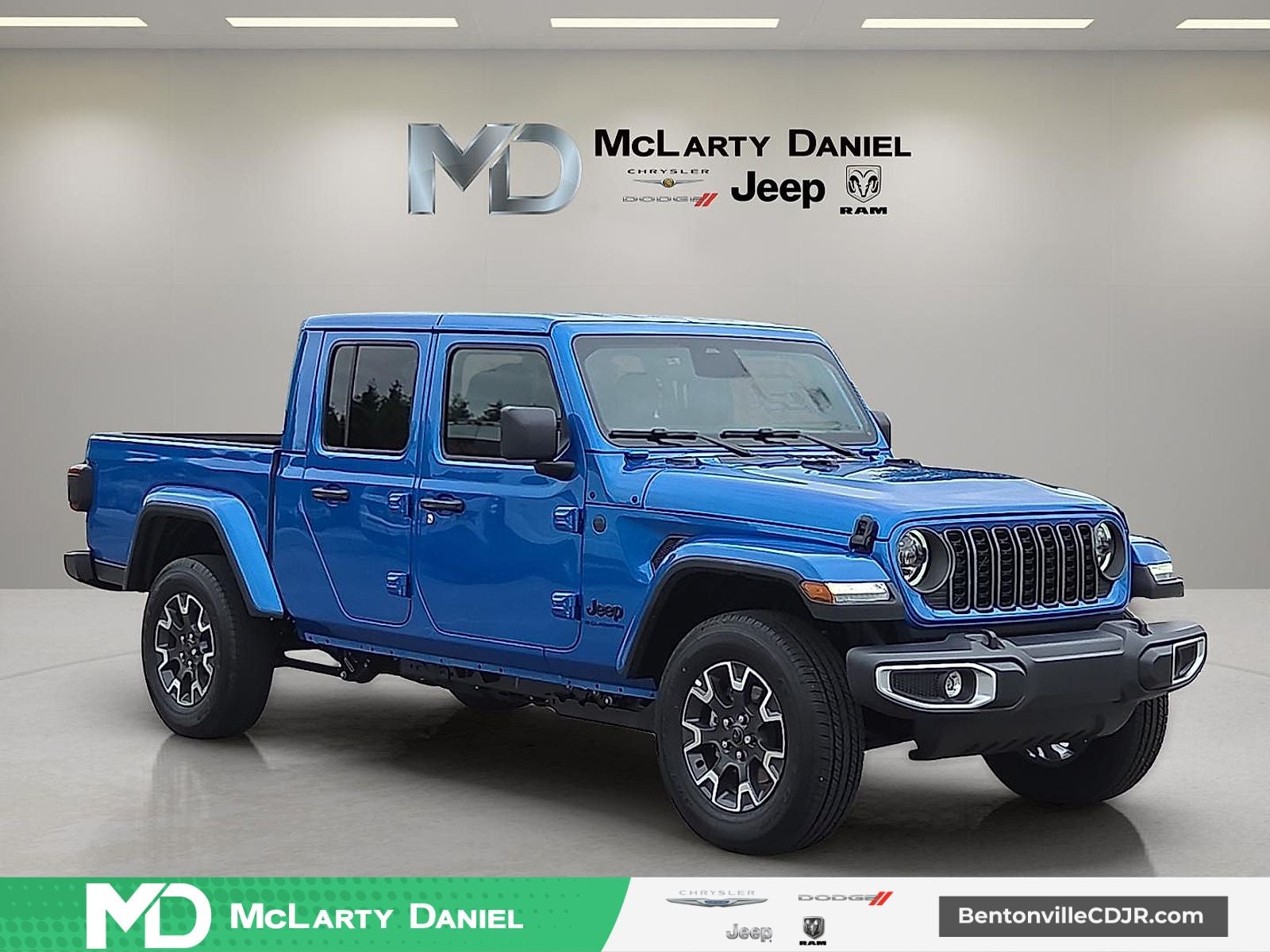 2026 Jeep Gladiator GLADIATOR SAHARA 4X4 in Hydro Blue Pearl-Coat Exterior Paint — front three-quarter view