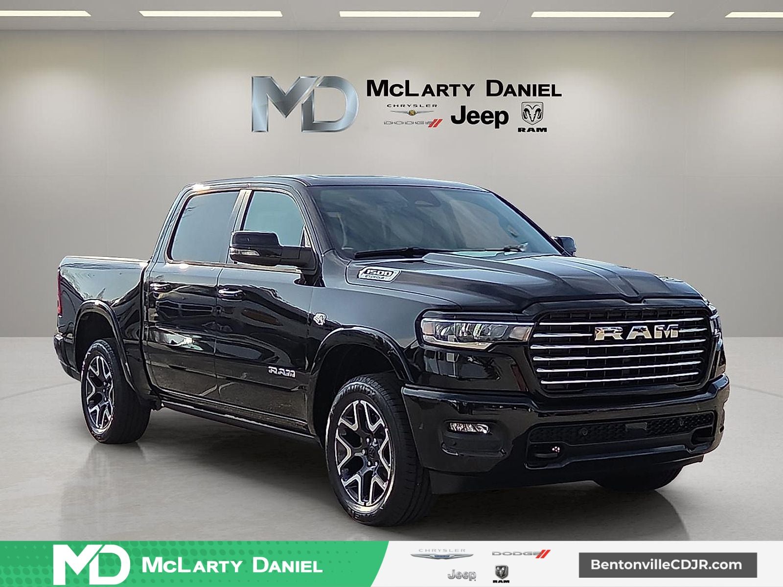 2026 RAM Ram 1500 RAM 1500 LARAMIE CREW CAB 4X4 5'7' BOX in Diamond Black Crystal Pearl-Coat Exterior Paint — front three-quarter view
