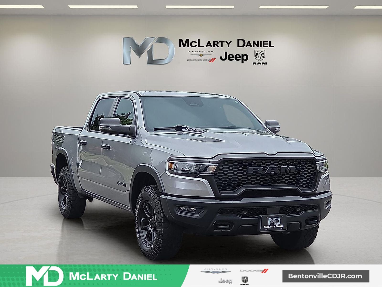 2025 RAM 1500 Rebel Crew Cab 4x4 5'7' Box in Billet Silver Metallic Clearcoat — front three-quarter view