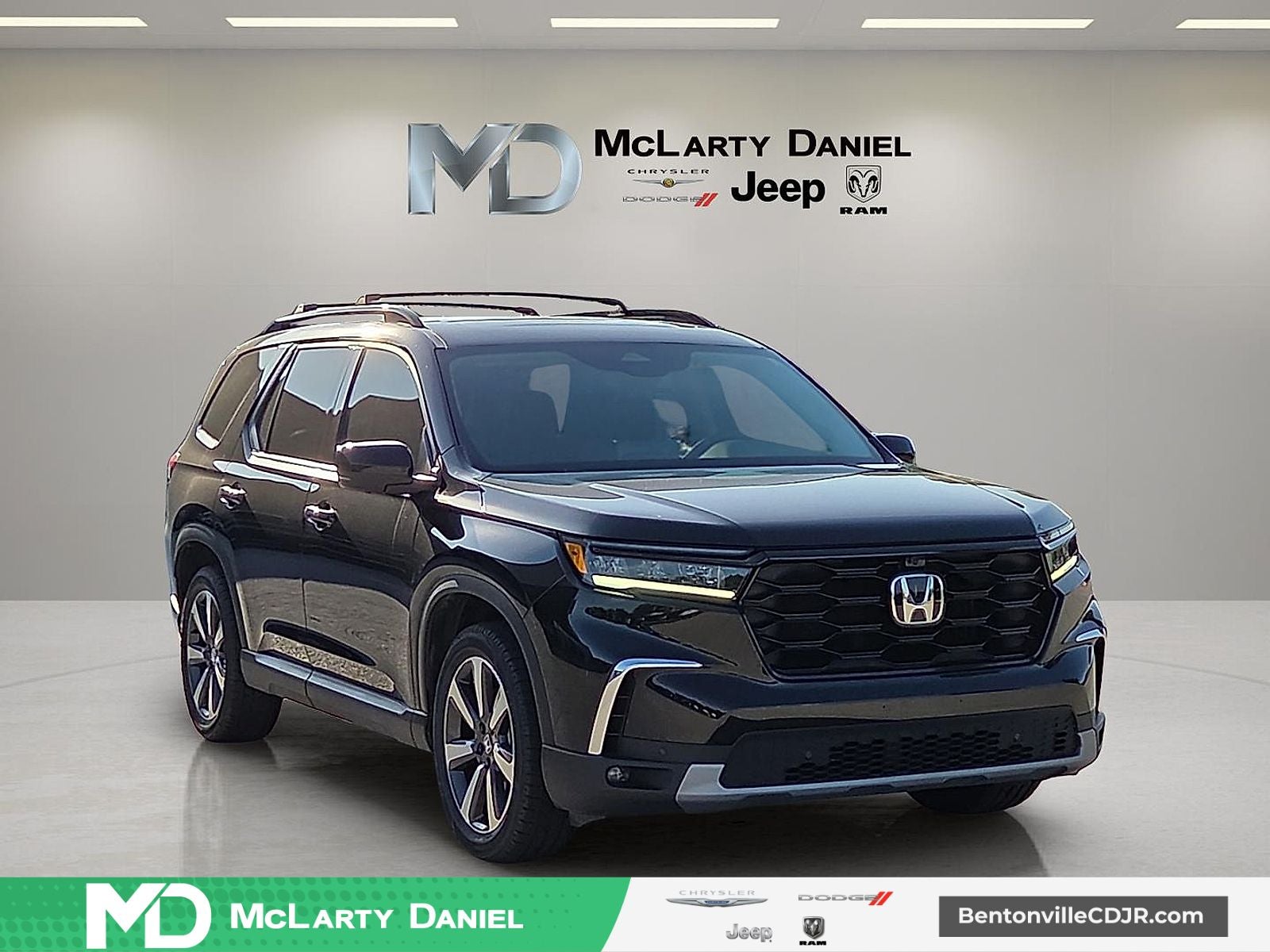 2023 Honda Pilot AWD Elite in Crystal Black Pearl — front three-quarter view