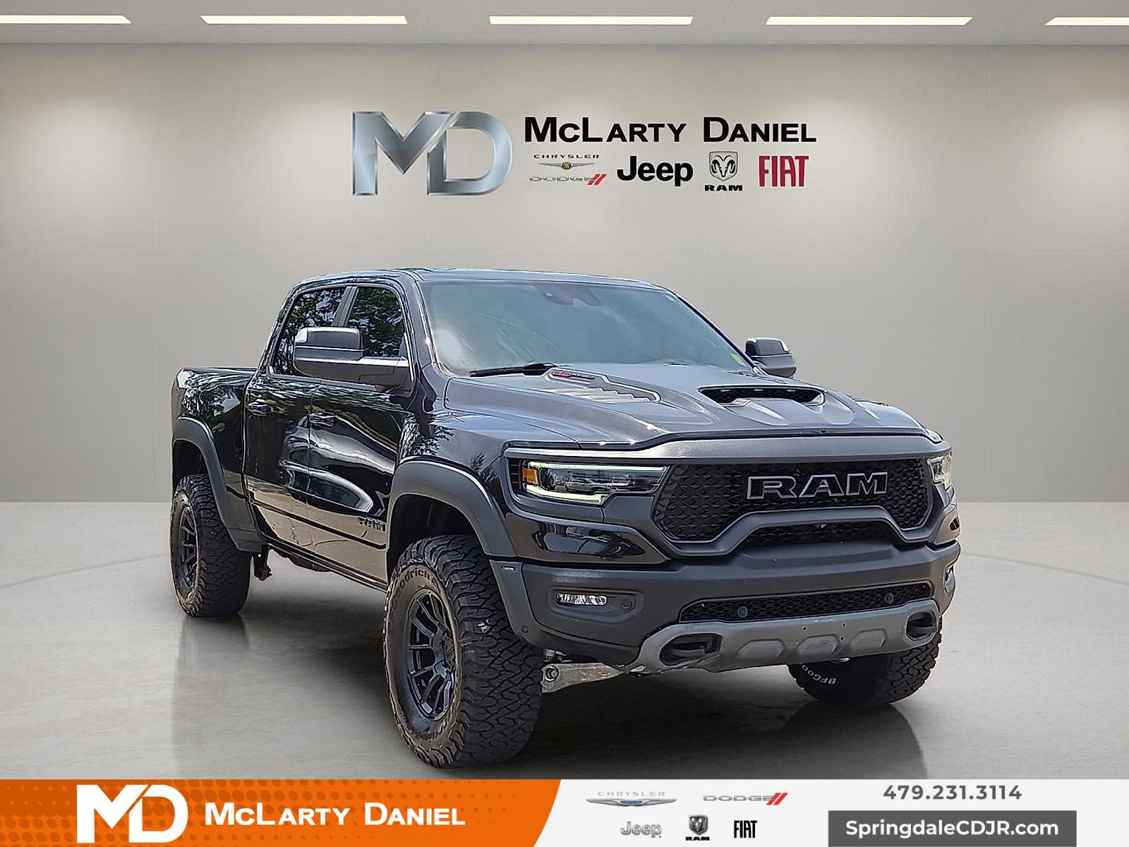 2022 RAM 1500 TRX Crew Cab 4x4 5'7' Box in Diamond Black Crystal Pearlcoat — front three-quarter view
