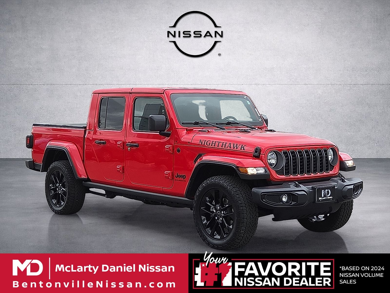 2025 Jeep Gladiator Nighthawk in Firecracker Red Clearcoat — front three-quarter view